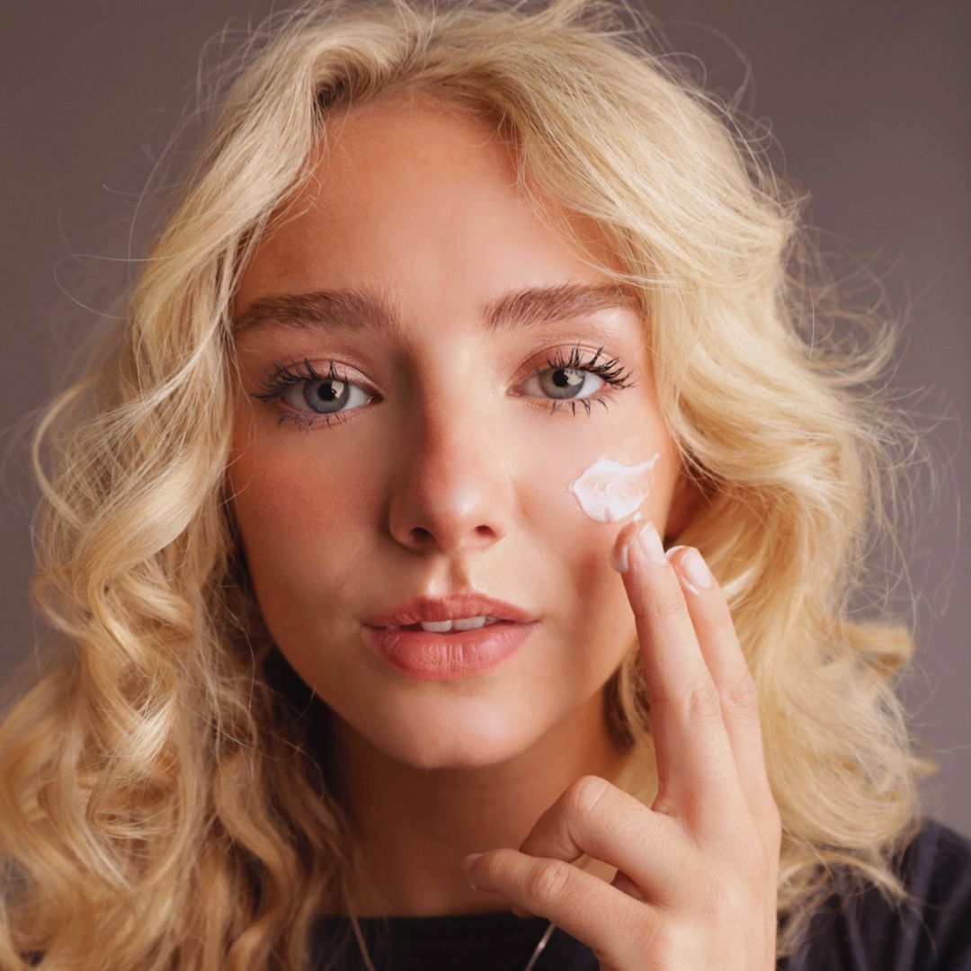 Woman applying Miriam's Rice Water Face Cream