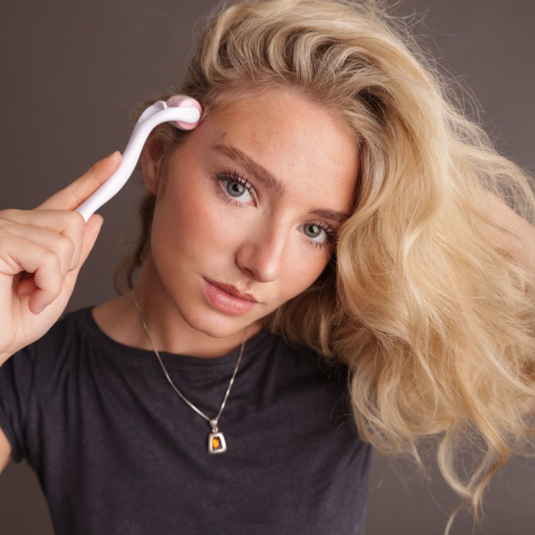 Woman with her own Miriam's Pink Hair Growth Roller